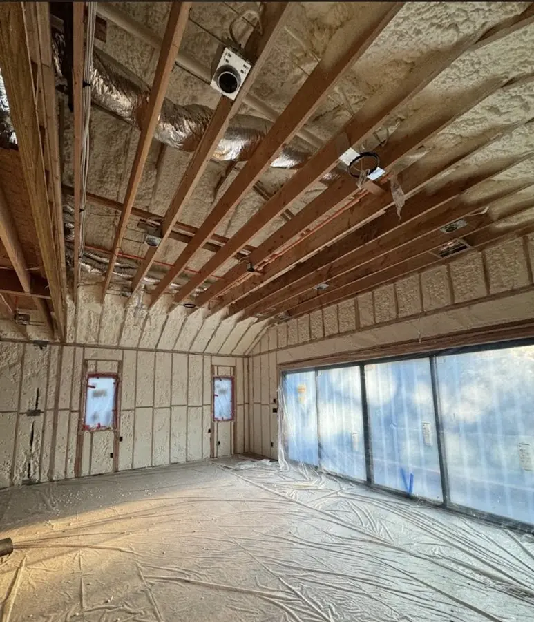 Interior walls and ceiling insulated with spray foam during new construction in Dumbarton